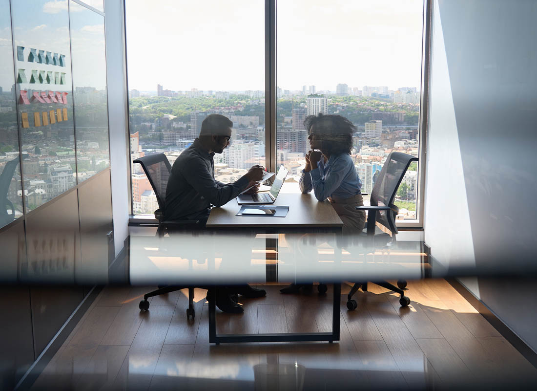 Careers - Interview of Potential New Employee in a Room with Windows and Sunlight Outside