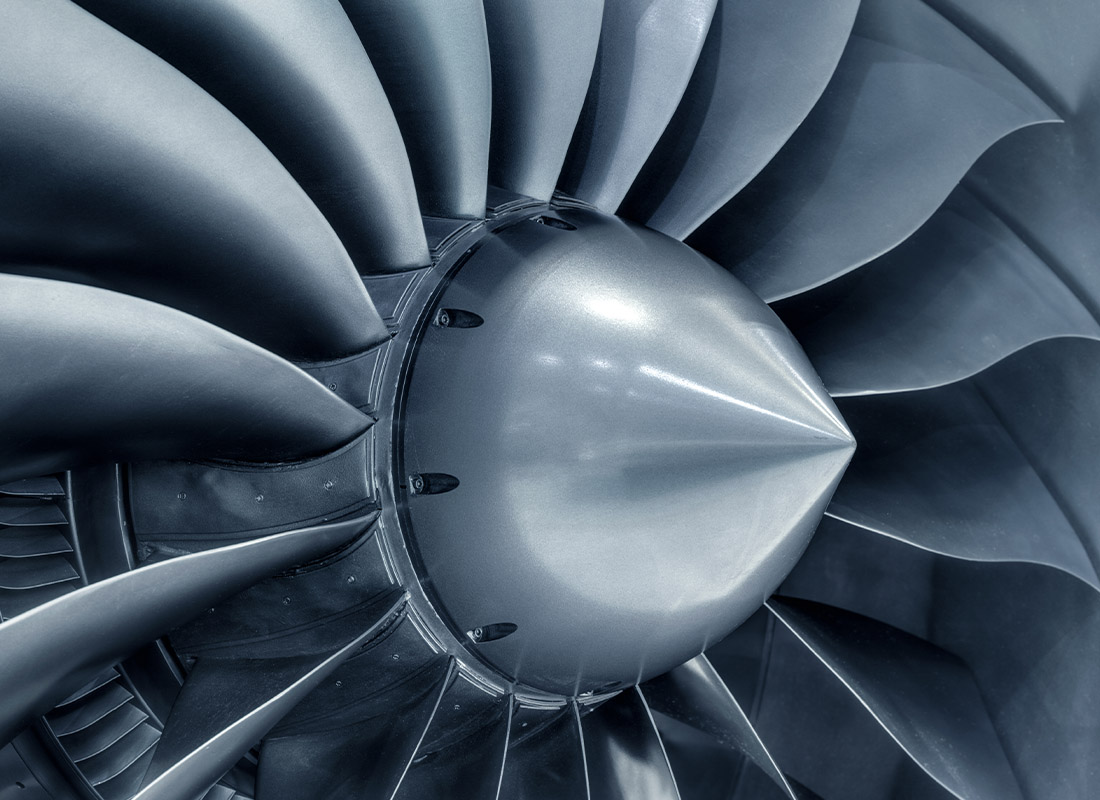 Insurance by Industry - Closeup of a Jet Engine in Metallic Gray and Silver Tones